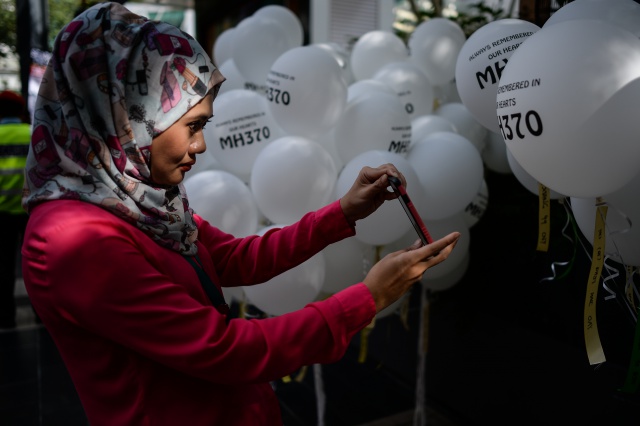 Two years on, MH370 kin want search extended.