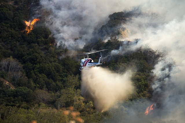 Firenadoes rage in California as blaze menaces 82,000