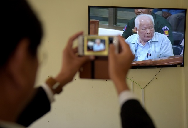 Top Khmer Rouge leader denies genocide at close of UN-backed trial