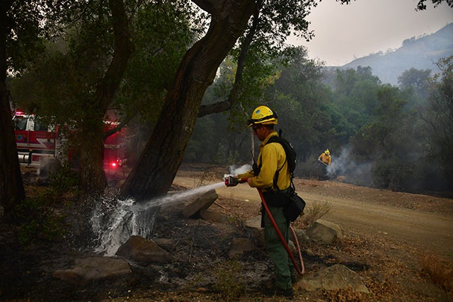 Winds whip California fires as they spread south