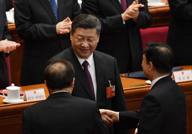 Empowered Xi says China ready to fight 'bloody battle'