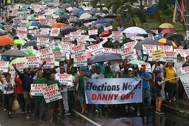 Opposition supporters march in Seychelles, demanding that the president resigns