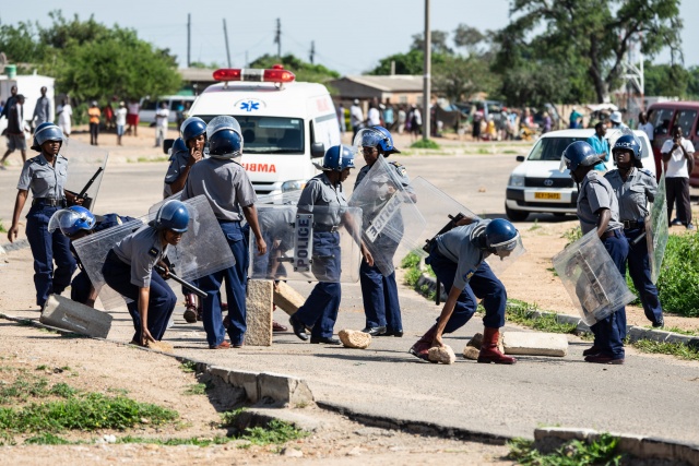 Zimbabwe president cuts short foreign tour over protests