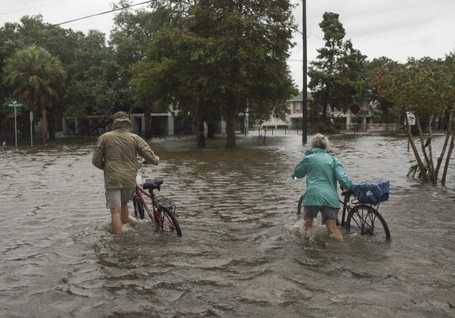 Barry weakens, but US officials warn of heavy rains, floods, tornadoes