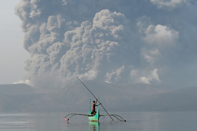 Philippines on alert as volcano spews ash, lava