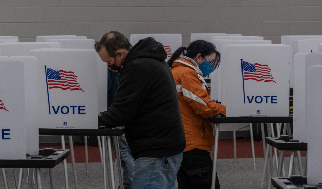 Anxious Americans show up for an election like no other