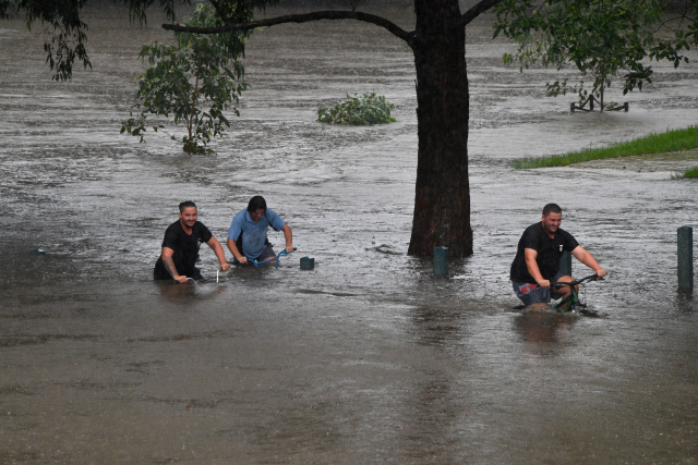 Evacuations ordered as Sydney's biggest dam overflows after record rainfall