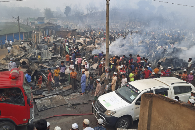 Tens of thousands flee huge blaze at Rohingya camp in Bangladesh