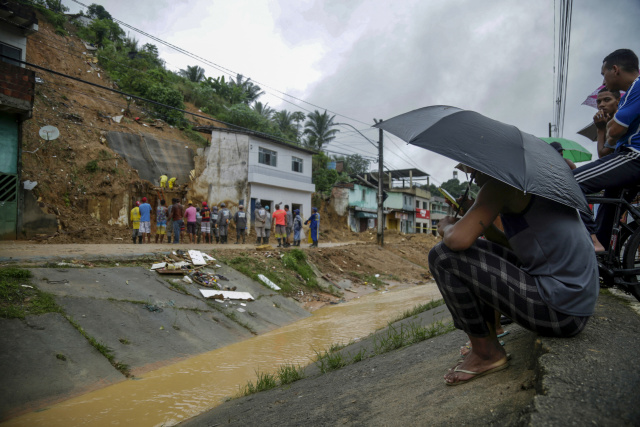 Death toll mounts from Brazil downpours as search continues