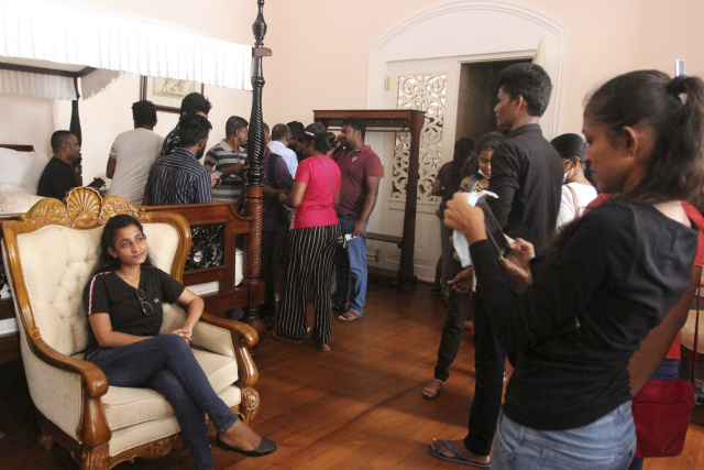 Laughter, piano at vacant Sri Lanka presidential palace