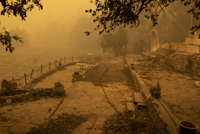 Year's largest fire burns through dry terrain to destroy California homes