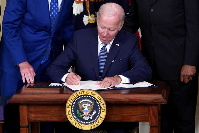 Biden signs major climate change, health care law