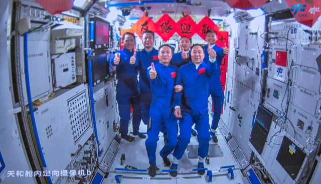 Chinese mission with first civilian reaches space station