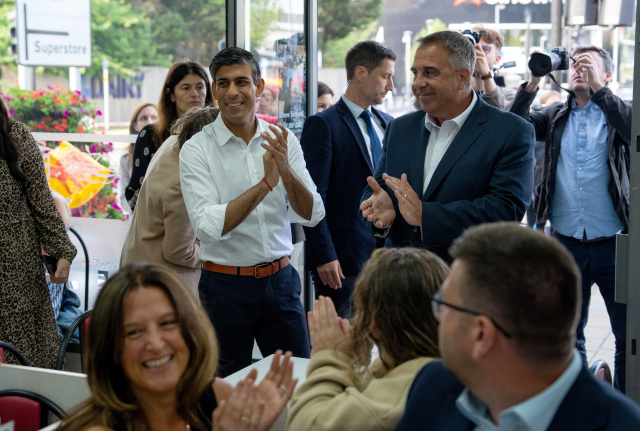 Ruling UK Conservatives suffer vote routs but avoid wipeout
