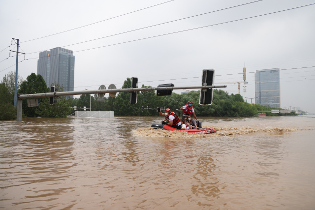 No power, no clean water: cleanup begins in Beijing's flood-hit suburbs