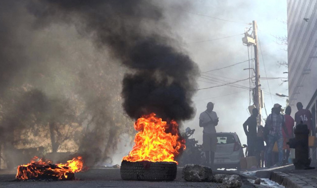 Haiti capital 'paralyzed' after unrest, PM still abroad