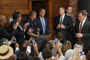 Trump vows not to quit race over lewd talk about women