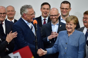 Weakened Merkel wins fourth term, hit by nationalist 'earthquake'